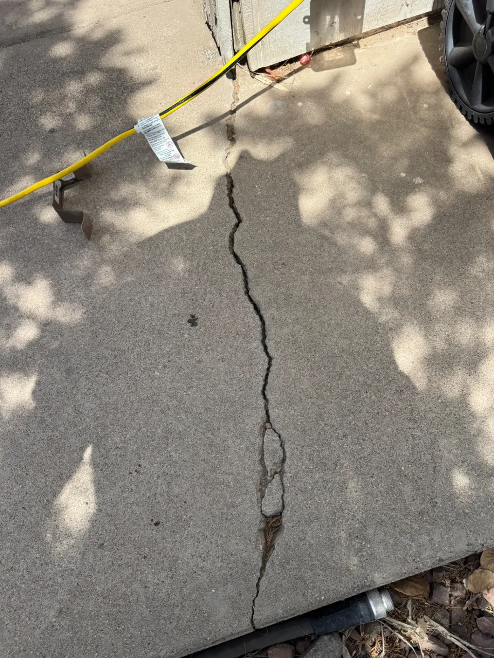 A crack running through the concrete slab edge of a Phoenix home